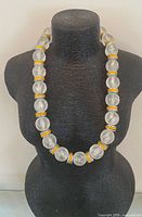 Full view of necklace on display bust showing bead size and spacer pattern