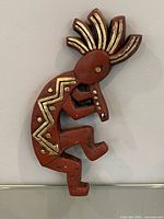 Full front view of Kokopelli ceramic wall piece
