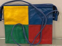 Front view showing multicolour leather patchwork and strap