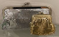 Silver clutch and gold coin purse front view
