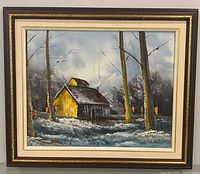 Full view of framed painting with cabin and snowy scene