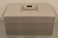 Closed container front view showing three stackable tiers