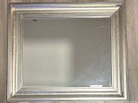 Front view of rectangular silver framed mirror