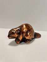 Left side view of copper/bronze beaver figurine