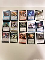 Full view of all 15 cards laid out in three rows on white surface