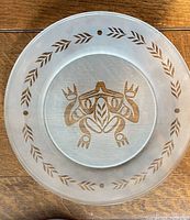 full plate showing frog motif and border