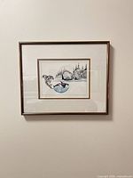 Framed Michael Duncan print on wall