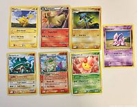 All seven Pokémon cards laid out