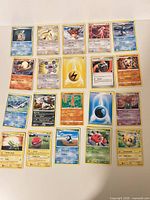Overall view of all 20 Pokémon cards laid out in four rows