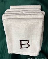 Stacked fingertip towels showing monogram B