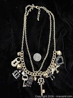 Full view of double-chain charm necklace with US quarter for scale