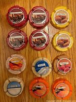 All 12 sealed fragrance discs arranged on floor