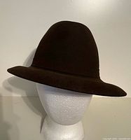 Front view of dark brown felt fedora on mannequin head