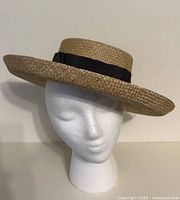 Front view of straw boater hat on mannequin head