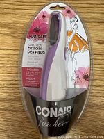 Front view of sealed Conair for Her foot care roller brush package