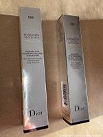 Front view of two boxed mascaras showing shade numbers 099 and 090