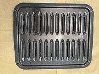 Top view of slotted broiler grate