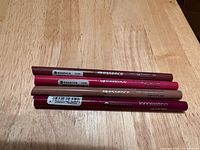 four essence automatic lipliners stacked showing barrels