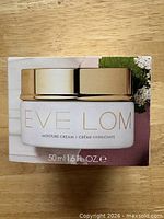 Front of boxed Eve Lom Moisture Cream showing product name, jar image, and volume