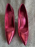 Top view of both metallic pink stiletto heels