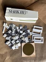 Embosser, loose tiles, frames, gold seal sticker laid out