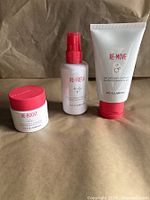 Front view of Re-Boost jar, Re-Fresh spray and Re-Move gel