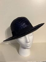 Front view of navy straw sun hat on mannequin head