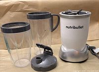 Power base, two tall cups (one with handle), sip/flip lid