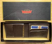 Wallet in open Renwick box showing exterior and interior pockets with inserts