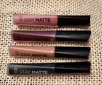 Four tubes of Rimmel Stay Matte lip colour laid horizontally