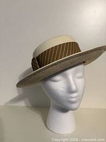 Front three-quarter view of straw boater hat on mannequin head