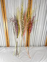 Full group of nine artificial plum blossom stems standing