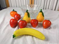 Group shot showing bowl and eight fruit figurines