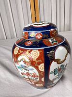 Front and side view of ginger jar showing Imari palette and floral panels