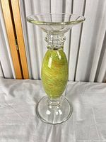 Full view of candlestick standing upright