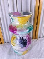 Front view of multicolor marbled glass vase