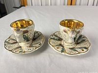 Both egg cup and saucer units front view