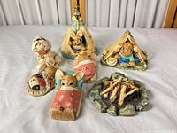 Overview of all seven Pendelfin camp figurines