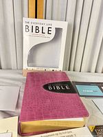 Bible with pink faux-croc cover, gold edges, and slipcase