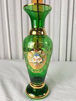 Front view showing floral medallion and gilt scrollwork