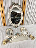 Group shot of large mirror, two small mirrors, crest piece and detached candle sconces