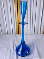 Full view of cobalt decanter with stopper inserted