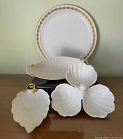 Group image showing all four Lenox pieces: dinner plate, oval dish, leaf dish, divided shell dish