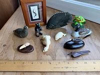 Group shot of all figurines and framed art for scale reference