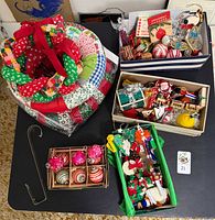 Overall lot showing three quilt wreaths, metal door hook, boxed vintage glass ornaments, trays of assorted ornaments