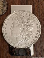 1883-S Morgan dollar mounted on silver-tone money clip