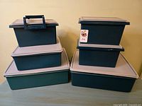 Front view of all six matching Tupperware containers stacked in two columns