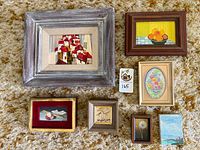 Front view group of seven framed miniature paintings