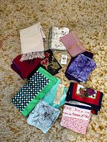 All scarves laid out on carpet