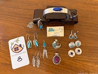 Complete lot laid out showing all 12 jewelry items